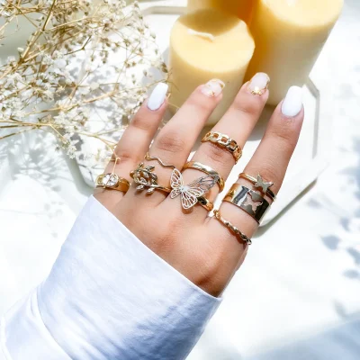 پک انگشتر پروانه برگ گل ستاره کارتیر طلایی