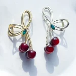 گیره مو گیلاس مینیمال گیره مو گیلاس آبنباتی قرمز گیره مو گیلاس طلایی گیره مو گیلاس قرمز آبنباتی نقره ای